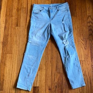 Patched distressed washed blue jeans